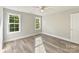 This room boasts a ceiling fan, two windows that brings in light and air, and a neutral paint palette at 3308 Watkins Rd, Monroe, NC 28110