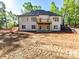 Rear exterior of a home showing the yard and a deck on the second floor at 3308 Watkins Rd, Monroe, NC 28110