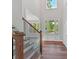 The home's entry reveals soaring ceilings, hardwood floors, a staircase and an abundance of light from the large windows at 3308 Watkins Rd, Monroe, NC 28110