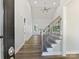 Inviting home entrance boasts soaring ceilings, wood floors, staircase, and abundant natural light at 3308 Watkins Rd, Monroe, NC 28110