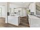 Open kitchen with modern cabinetry, quartz countertops, and a kitchen island at 3308 Watkins Rd, Monroe, NC 28110