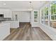 Bright eat-in kitchen boasts modern light fixture, gray cabinets, stainless appliances and natural light at 3308 Watkins Rd, Monroe, NC 28110