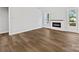 Cozy living room with a modern fireplace and large windows at 3308 Watkins Rd, Monroe, NC 28110