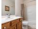 Bathroom features a wood vanity, toilet, shower and bathtub combination at 43014 Mimosa Ct, Indian Land, SC 29707