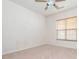 This bedroom has a ceiling fan and a window to provide plenty of light at 43014 Mimosa Ct, Indian Land, SC 29707
