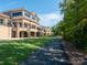 This exterior view shows a 2 story building with a path to walk along at 43014 Mimosa Ct, Indian Land, SC 29707