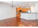 Bright kitchen featuring stainless steel appliances, breakfast bar, and hardwood floors at 43014 Mimosa Ct, Indian Land, SC 29707