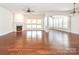Open concept living space features hardwood floors, fireplace and large windows for plenty of natural light at 43014 Mimosa Ct, Indian Land, SC 29707
