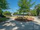 Well-maintained tennis courts with lighting and surrounding trees create a relaxing yet active atmosphere at 43014 Mimosa Ct, Indian Land, SC 29707