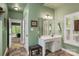 Bathroom featuring a white vanity with drawers and countertop space, accompanied by a stool for convenience at 4516 Stryker Dr, Matthews, NC 28104