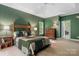 Cozy bedroom with a bed, natural light, and a dresser at 4516 Stryker Dr, Matthews, NC 28104