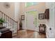 Foyer with beautiful hardwood floors, high ceilings, and views into the entryway at 4516 Stryker Dr, Matthews, NC 28104