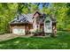 Home with brick exterior, manicured lawn, and a two-car garage under a blue sky at 4516 Stryker Dr, Matthews, NC 28104