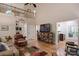 Bright living room boasting high ceilings, hardwood floors, and a comfortable leather armchair at 4516 Stryker Dr, Matthews, NC 28104