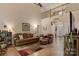 Inviting living room with high ceilings, hardwood floors, and comfortable leather furniture at 4516 Stryker Dr, Matthews, NC 28104
