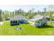 Aerial view of the house with a spacious green lawn and outbuildings at 4594 N Wynswept Dr, Maiden, NC 28650