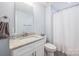 Bathroom featuring a single sink, granite countertops, with a towel rack and shower with curtain at 4594 N Wynswept Dr, Maiden, NC 28650