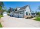 Beautiful light-blue home with a long driveway and multiple car garages at 4594 N Wynswept Dr, Maiden, NC 28650