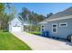Detached garage of home with carport and lush green lawn at 4594 N Wynswept Dr, Maiden, NC 28650