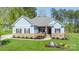 Charming single-story home featuring stone accents and a beautifully landscaped front yard at 4594 N Wynswept Dr, Maiden, NC 28650