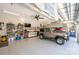 Spacious garage with epoxy floors, car lift, work bench and car memorabilia at 4594 N Wynswept Dr, Maiden, NC 28650