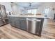 Kitchen island with stainless steel dishwasher, sink, white countertops and modern cabinetry at 4594 N Wynswept Dr, Maiden, NC 28650