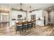 Modern kitchen with an island, stainless steel appliances, and stylish pendant lighting at 4594 N Wynswept Dr, Maiden, NC 28650