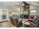 Open-concept living room with vaulted ceilings, fireplace, and access to the outdoors at 4594 N Wynswept Dr, Maiden, NC 28650