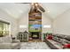 Inviting living room featuring a stone fireplace, wood accent wall, and comfortable seating at 4594 N Wynswept Dr, Maiden, NC 28650