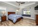 Comfortable bedroom with hardwood floors, tray ceiling, and windows with a cozy window seat at 4594 N Wynswept Dr, Maiden, NC 28650