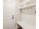Bright mudroom with a built-in bench, coat hooks, and shelving for organized storage at 4594 N Wynswept Dr, Maiden, NC 28650