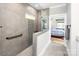 A tiled walk-in shower with a glass partition features a mosaic accent wall and shower seat at 4594 N Wynswept Dr, Maiden, NC 28650