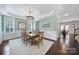 Sophisticated dining room featuring a chandelier, hardwood floors, and architectural ceiling detail at 5025 Willing Ct, Fort Mill, SC 29707