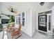 Inviting front porch with rocking chairs and a ceiling fan, perfect for enjoying the outdoors at 5025 Willing Ct, Fort Mill, SC 29707