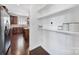 Hallway featuring shelves and easy access to the gourmet kitchen with stainless steel appliances at 5025 Willing Ct, Fort Mill, SC 29707