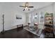 Well-lit home office featuring plantation shutters, hardwood floors, and modern décor at 5025 Willing Ct, Fort Mill, SC 29707