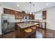 Gourmet kitchen featuring stainless steel appliances, granite counters, and a large kitchen island with seating at 5025 Willing Ct, Fort Mill, SC 29707
