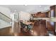 Open concept kitchen with stainless appliances, granite counters, and hardwood floors into the breakfast area at 5025 Willing Ct, Fort Mill, SC 29707