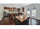Eat-in kitchen features stainless appliances, granite counters, and a breakfast bar with an adjacent breakfast nook at 5025 Willing Ct, Fort Mill, SC 29707
