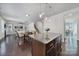 Open floor plan with views from the kitchen featuring stainless appliances and granite counters to the living room at 5025 Willing Ct, Fort Mill, SC 29707