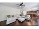 Spacious living room with dark wood floors and a large sectional sofa, perfect for entertaining at 5025 Willing Ct, Fort Mill, SC 29707