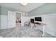 Well-lit office space with a modern desk and a view into an adjacent living area at 5025 Willing Ct, Fort Mill, SC 29707