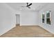 Bright bedroom with modern ceiling fan, wood-look flooring, and large windows for natural light at 504 Christopher Ln, Chester, SC 29706