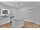 Modern kitchen showcasing granite counters, a kitchen island, and white cabinetry at 504 Christopher Ln, Chester, SC 29706