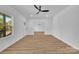 Spacious living room with wood-look floors, modern ceiling fan, and lots of natural light at 504 Christopher Ln, Chester, SC 29706