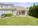 Charming backyard featuring a patio area, lush lawn, and privacy with mature landscaping at 512 Park View Dr, Belmont, NC 28012
