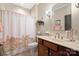 Charming bathroom featuring a vanity with storage, a commode, and shower with decorative curtain at 512 Park View Dr, Belmont, NC 28012