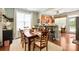 Open concept dining room leading into kitchen, perfect for entertaining with plenty of natural light at 512 Park View Dr, Belmont, NC 28012
