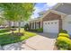 Charming home featuring a one car garage, a stone facade, and beautiful landscaping and manicured lawn at 512 Park View Dr, Belmont, NC 28012