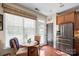 Bright kitchen featuring wood cabinets, stainless appliances, and eat-in breakfast nook with natural light at 512 Park View Dr, Belmont, NC 28012